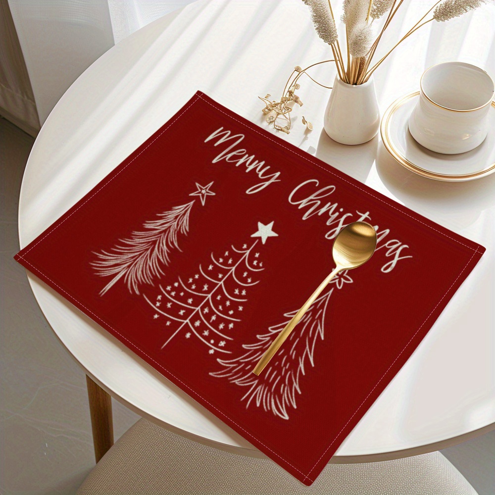 Christmas Table Runner - ミニマルな赤い背景に白いシンプルなクリスマスツリーと「メリークリスマス」の文字が描かれた、リネン製のテーブルマット。ホリデーシーズンに最適なテーブルランナーとして。